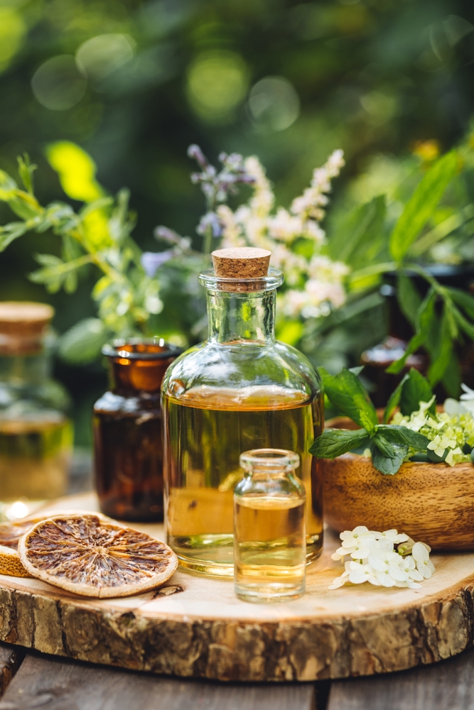 herbs, oil in jars, and dried lemon slices