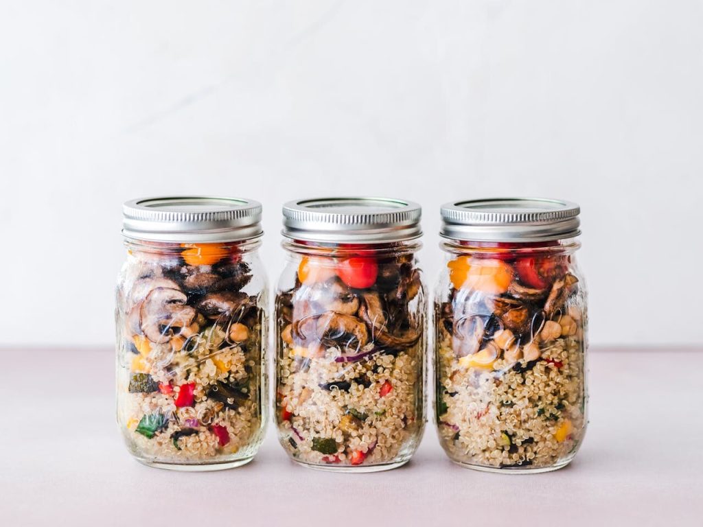 brown quinoa in bowl with spoon